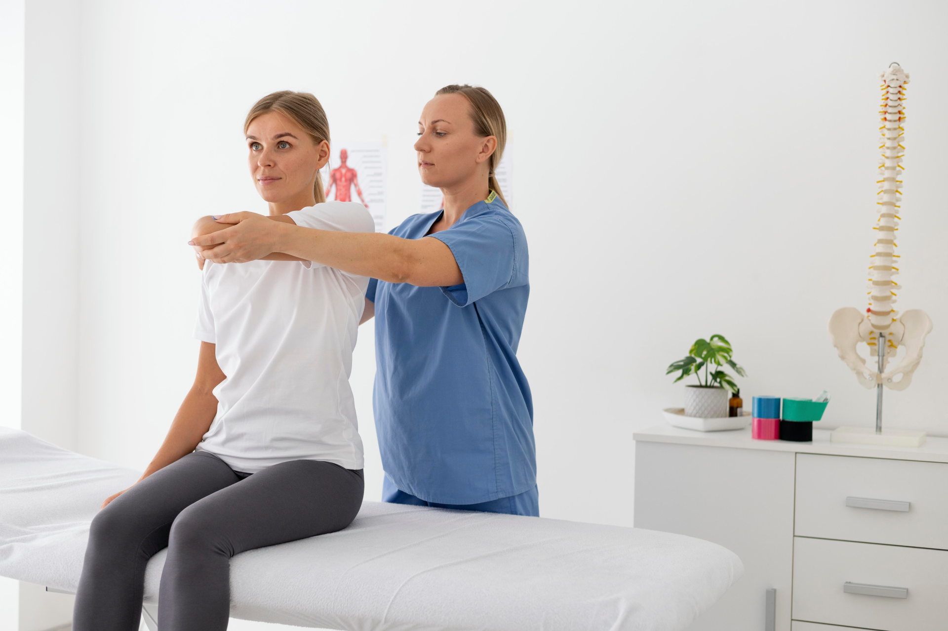 physiotherapist-helping-female-patient-her-clinic1